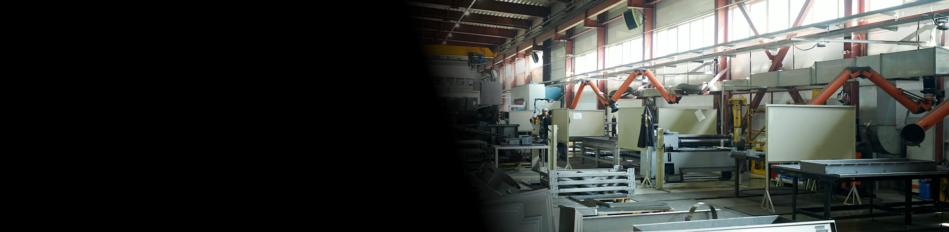 Interior view of a custom sheet metal manufacturing facility with production equipment