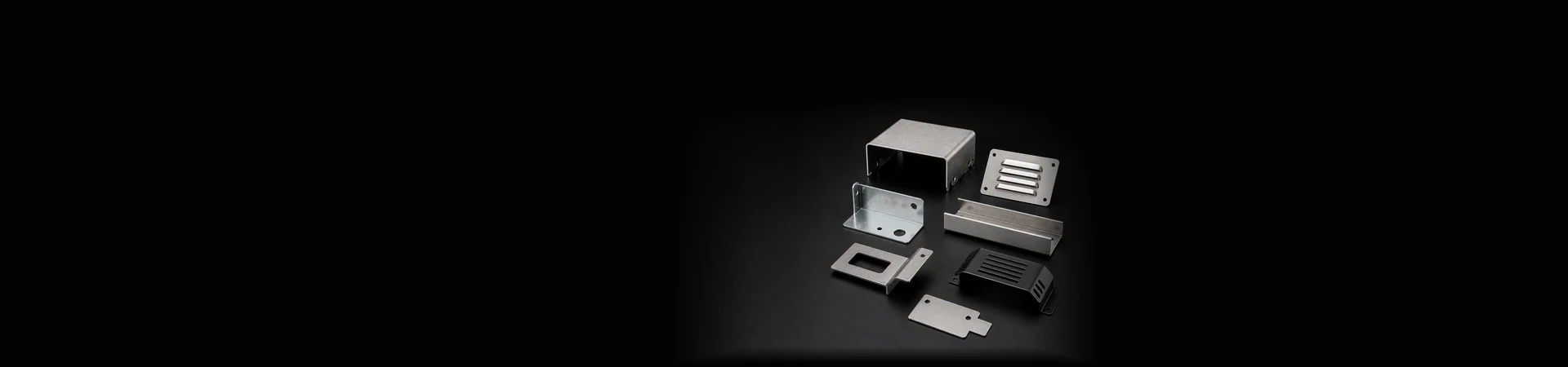 Custom fabricated sheet metal parts including louver panels, folded covers, mounting plates and protective guards