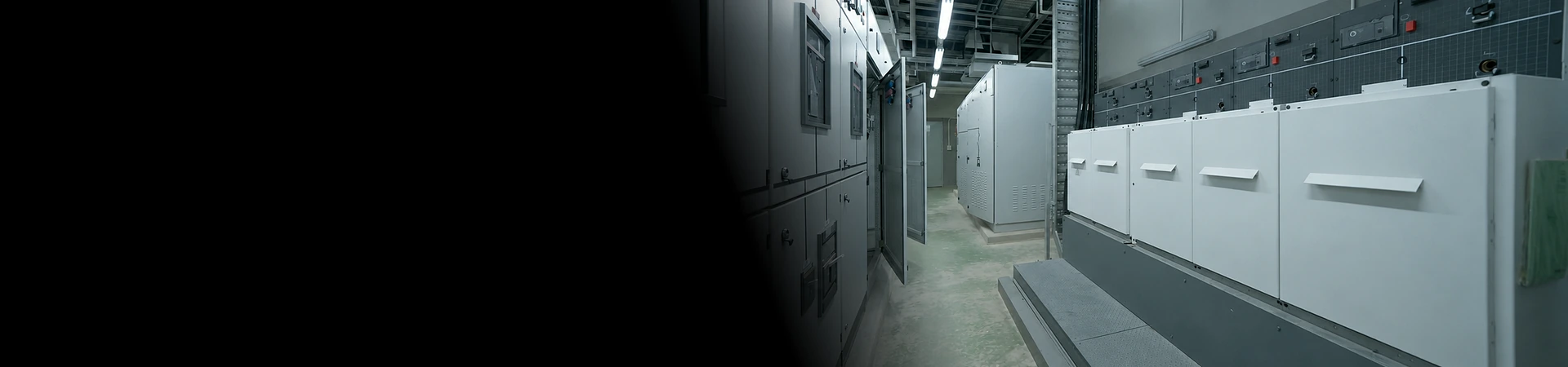 Custom sheet metal electrical switchgear enclosures installed in an industrial facility