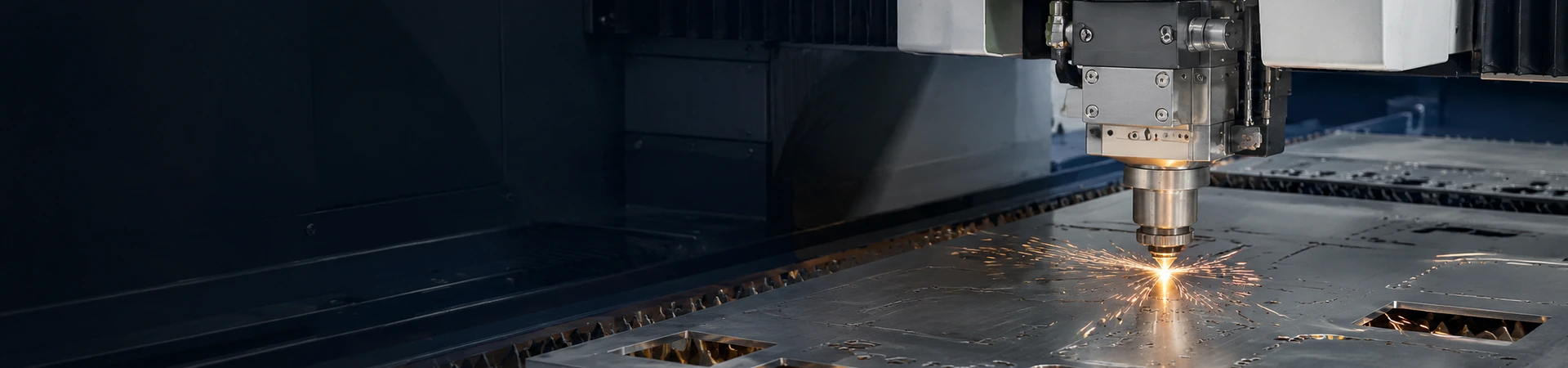 Fiber laser cutting machine processing sheet metal with precise cutouts and controlled sparks