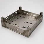 Welded equipment chassis frame with laser-cut holes, formed panels and welded corner supports